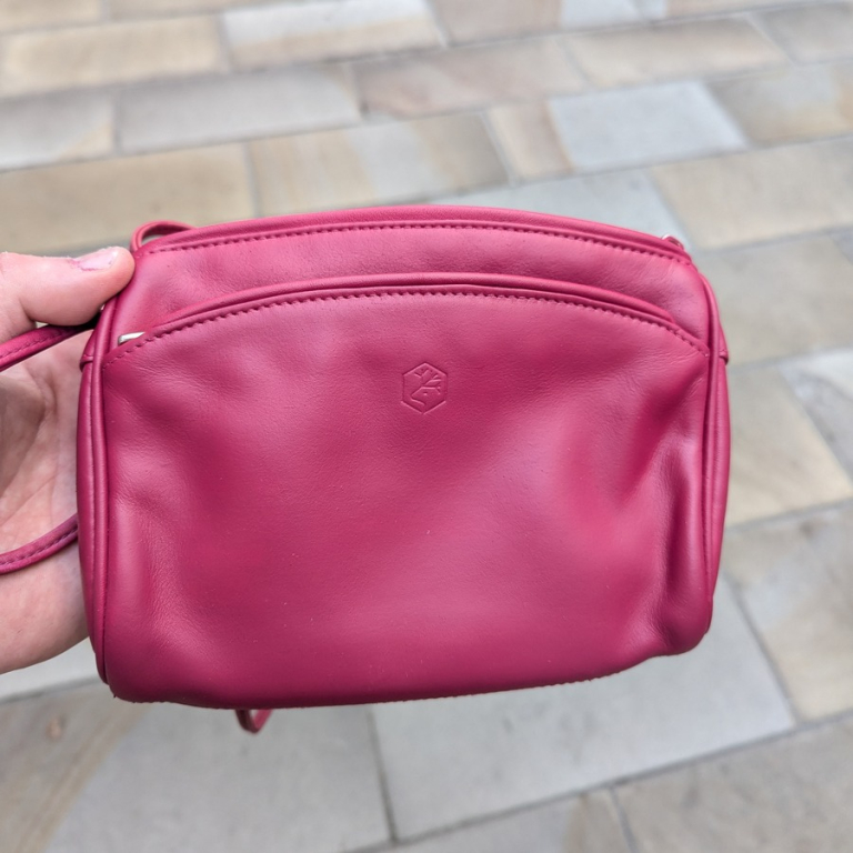 Front of pink purse after restoration